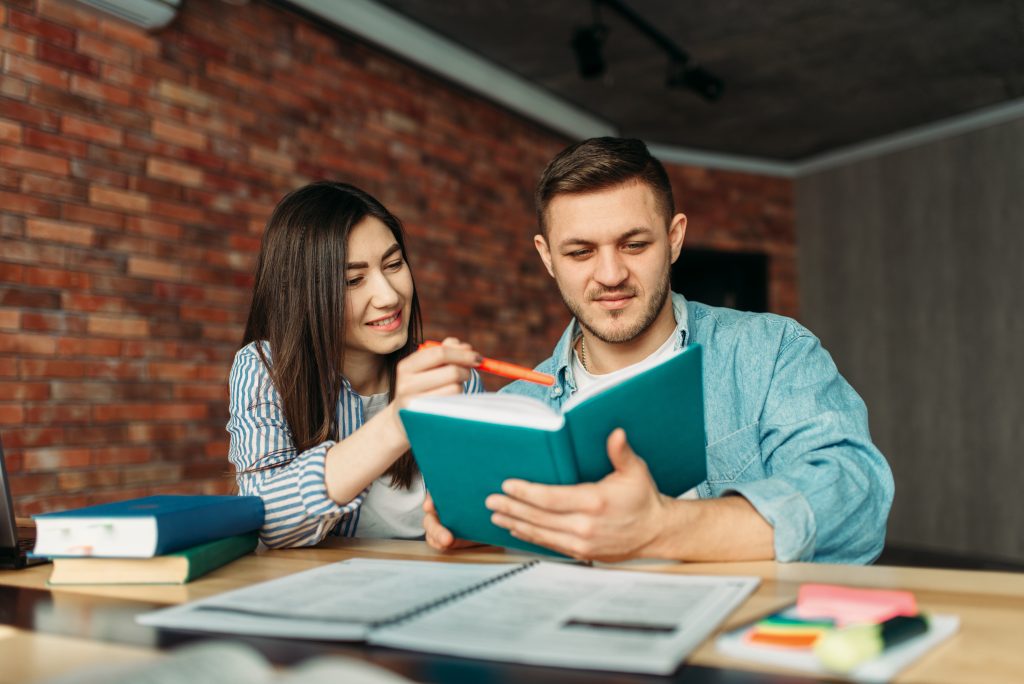 Two students study for an English exam together