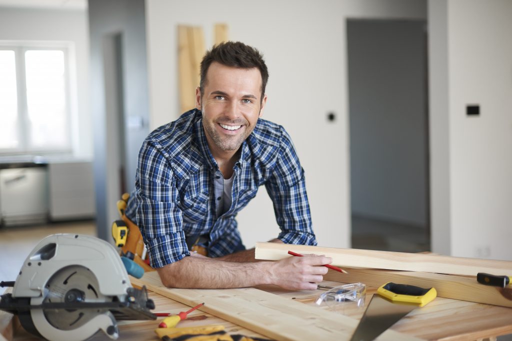 A Red Seal Carpenter stands at his work station