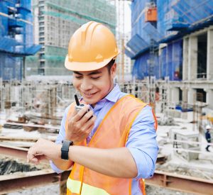 A bc building code inspector communicates at a job site