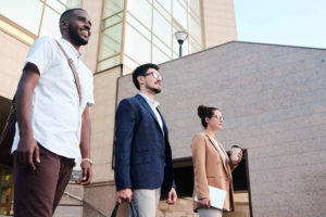 3 people standing outside with different personality types and careers